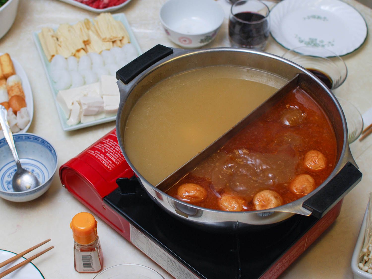 Chinese hot pot filled with two different broths.