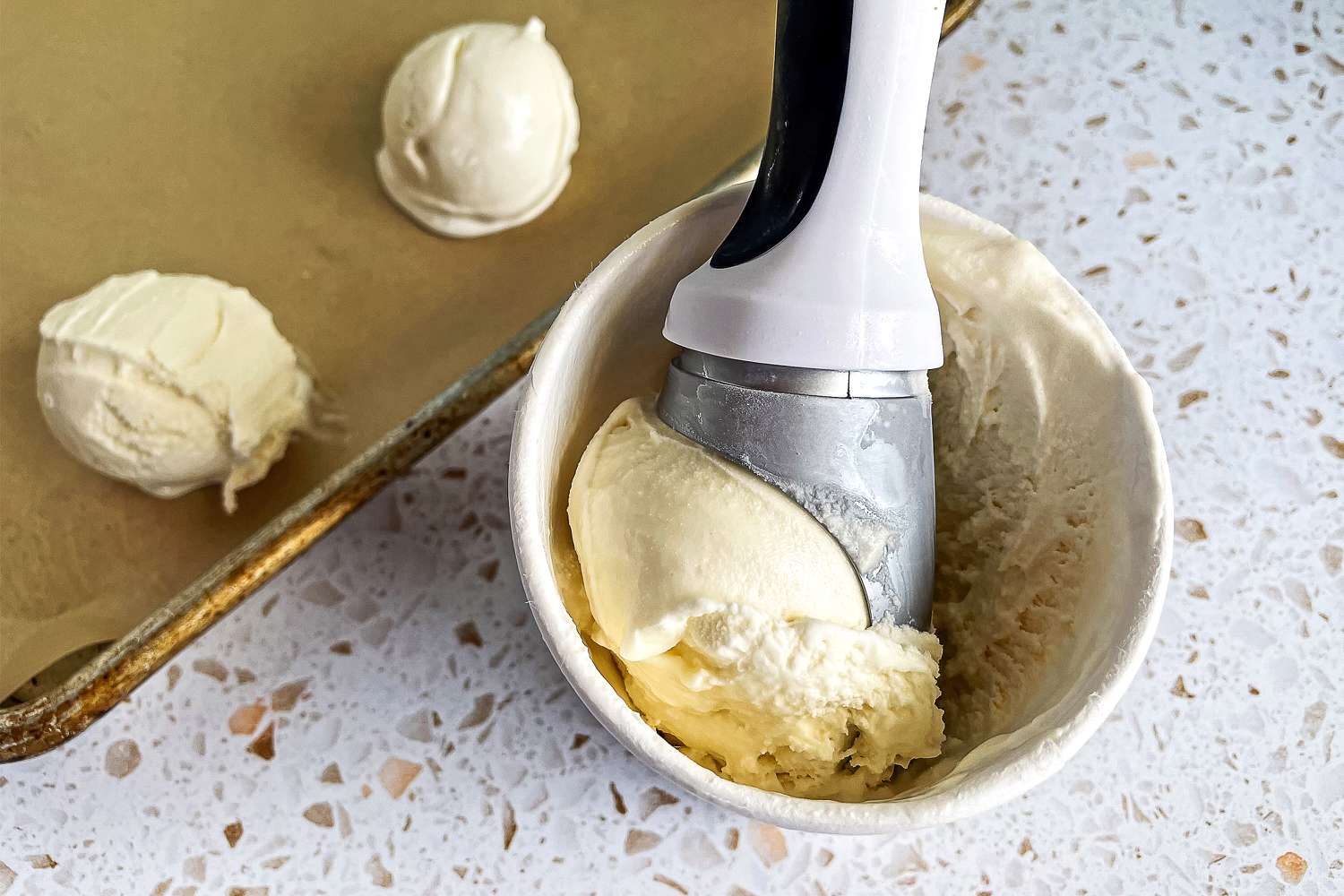 a scoop of ice cream in the bowl of the zyliss 