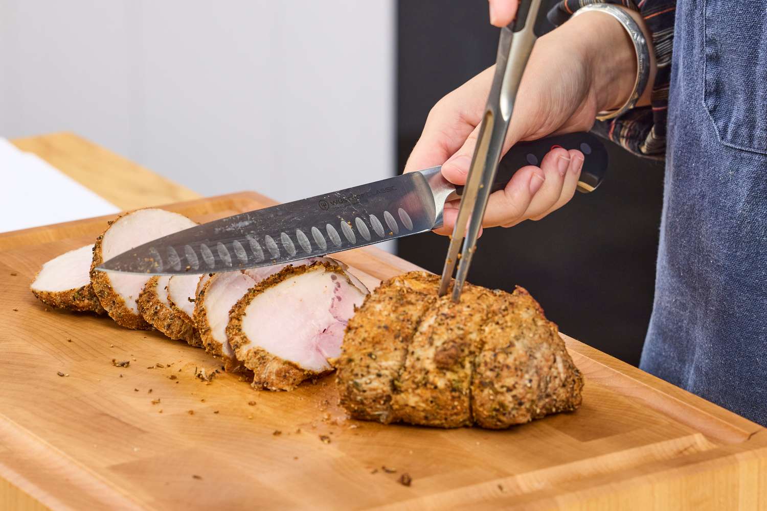 Meat is sliced using the Wüsthof Classic Carving Set