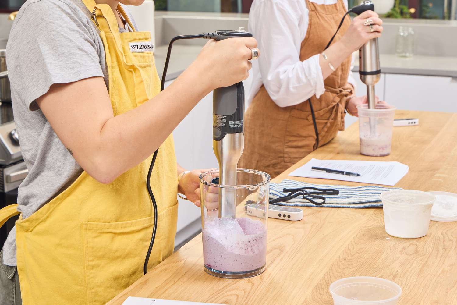 A person makes a smoothie using the Breville Control Grip Immersion Blender