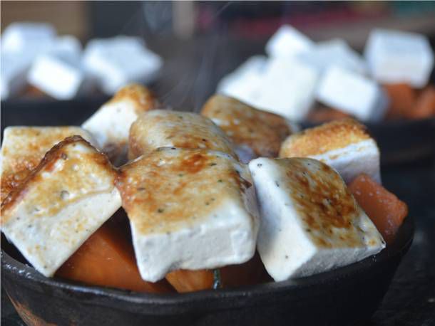 Closeup of brown butter and sage sweet potato casserole.
