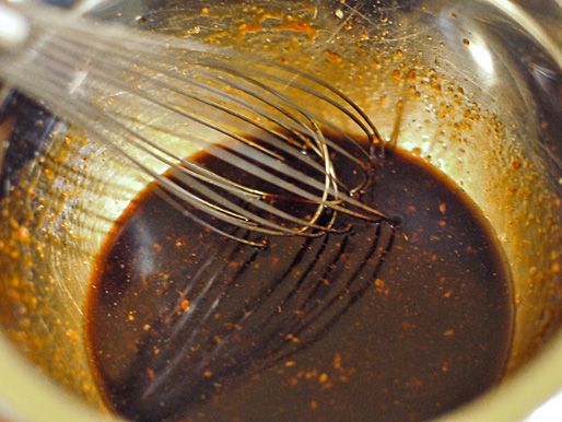 Whisking together ingredients for hoisin glaze.