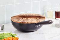 Souped Up Recipes Carbon Steel Wok with cover on kitchen counter
