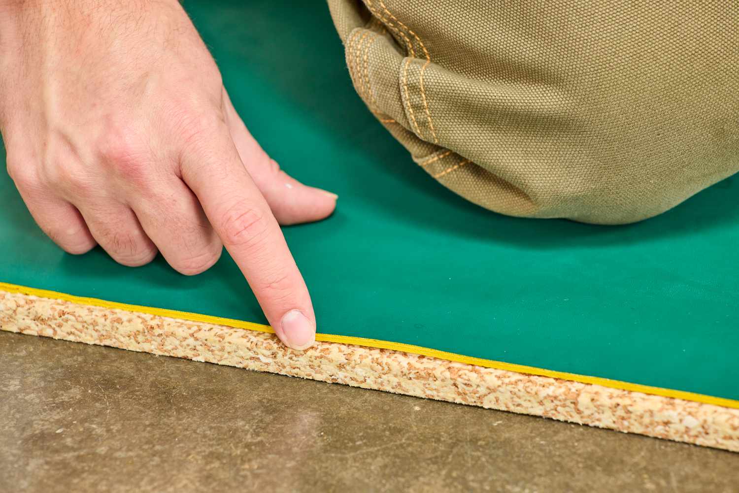 A person touches the cork bottom of the Fulton Standing Mat