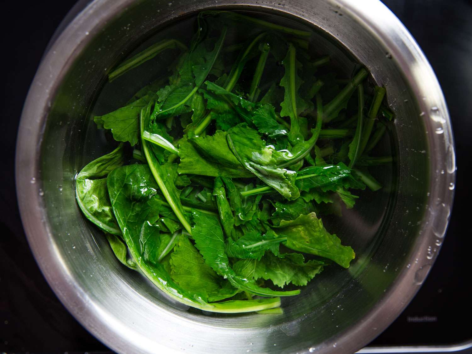 Blanched turnip greens shocked in cold water.