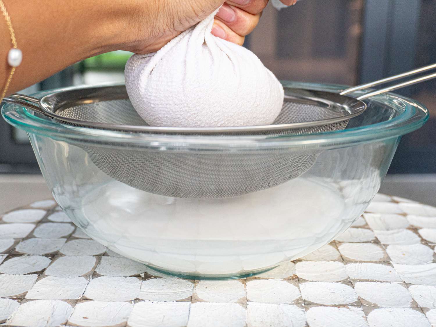 Side view of straining coconut