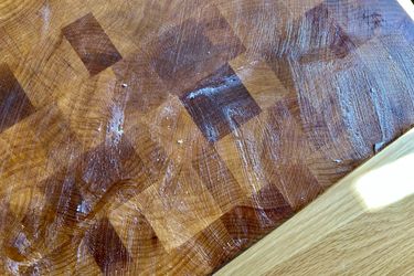 Boos Block Board Cream slathered on a wooden cutting board