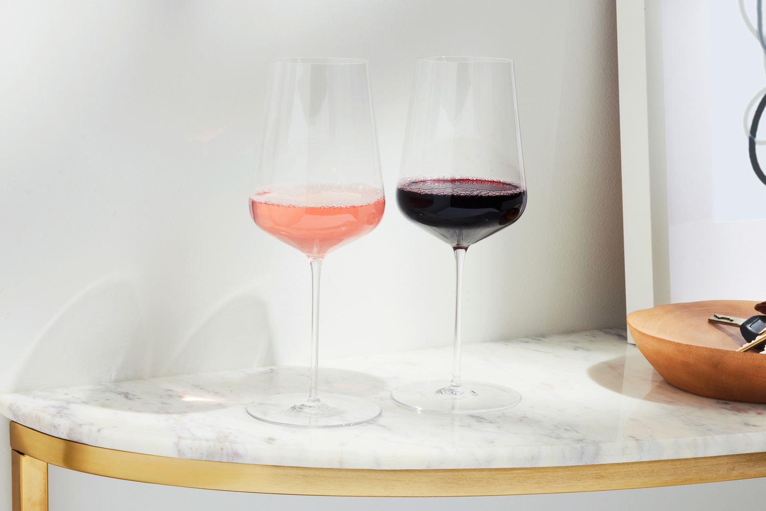 Zalto Denk'Art Universal Hand-Blown Wine Glasses filled with red and rosé wines on marble surface