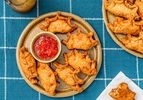 Overhead view of empanadas on a checkered blue background