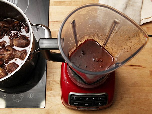 Blending part of the black bean soup in a countertop blender.
