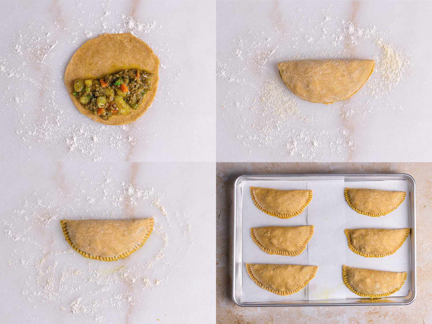 Meat pies filled and sealed on a lined sheet pan ready to rest.