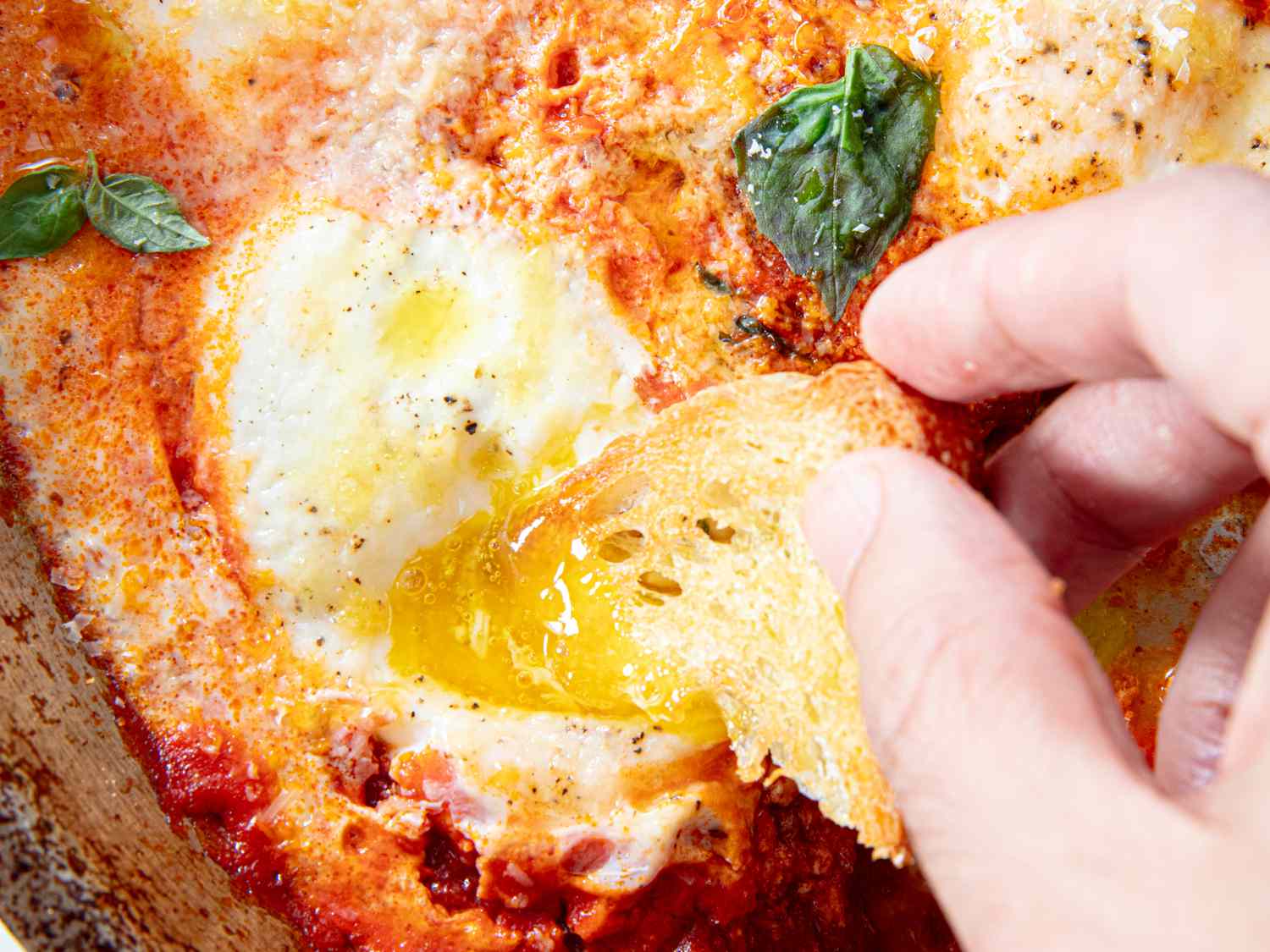 Close up of dipping bread in eggs