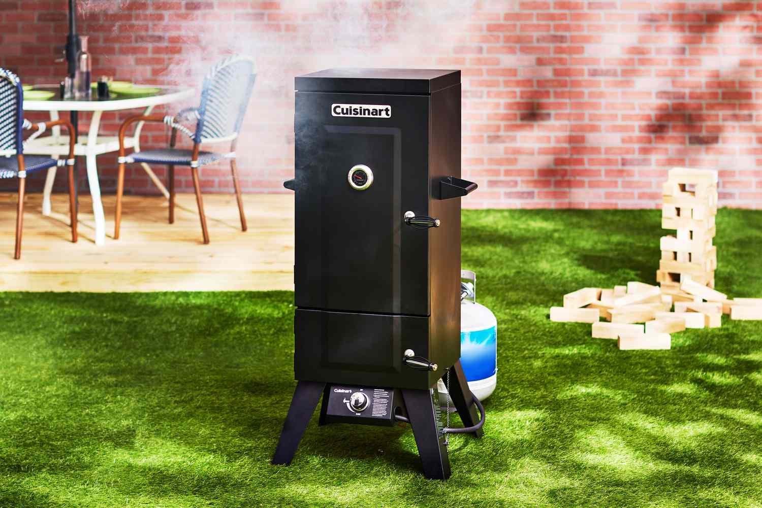 A staged shot of the Cuisinart COS-244 Vertical Propane Smoker