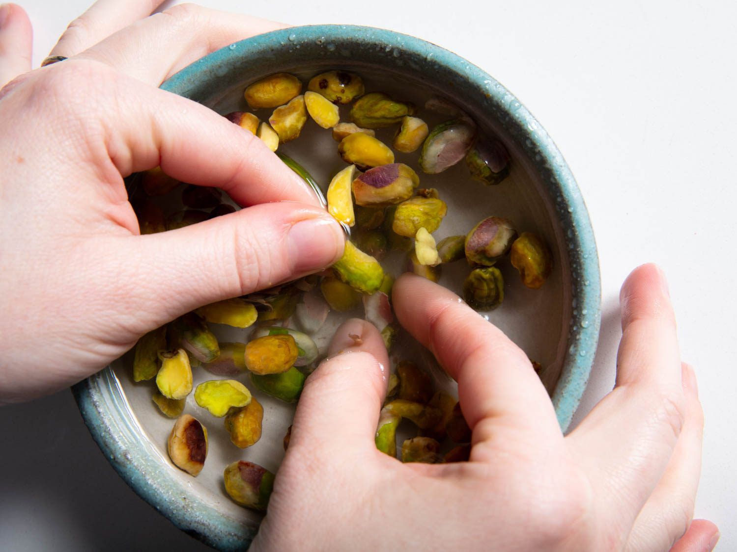 loosening the skins in a bowl of water
