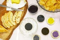 Island Creek Caviar Displayed on Table With Service Items