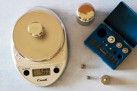 The Escali kitchens scale with weights beside it.