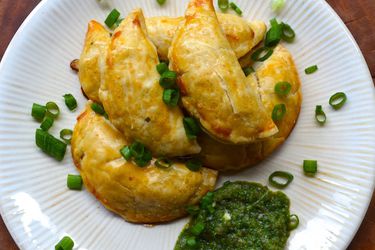 Overhead view of Potato and Corn Empanadas With Aji