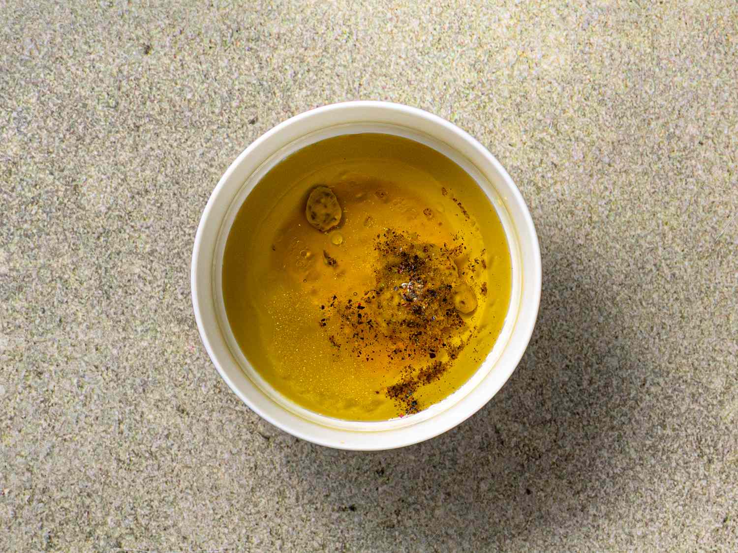 Small container of seasoned olive oil