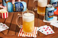 a can of sam adams golden poured into glass