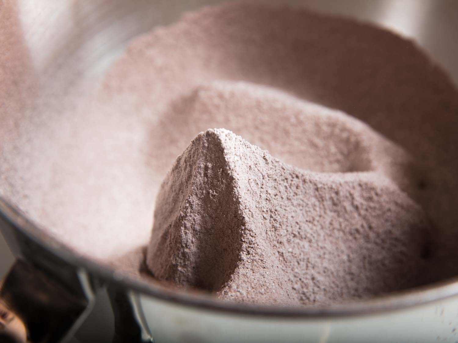 Mounds of sifted cocoa and powdered sugar.