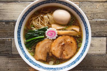 A bowl of shoyu ramen from Ramen Shack on a tabletop.