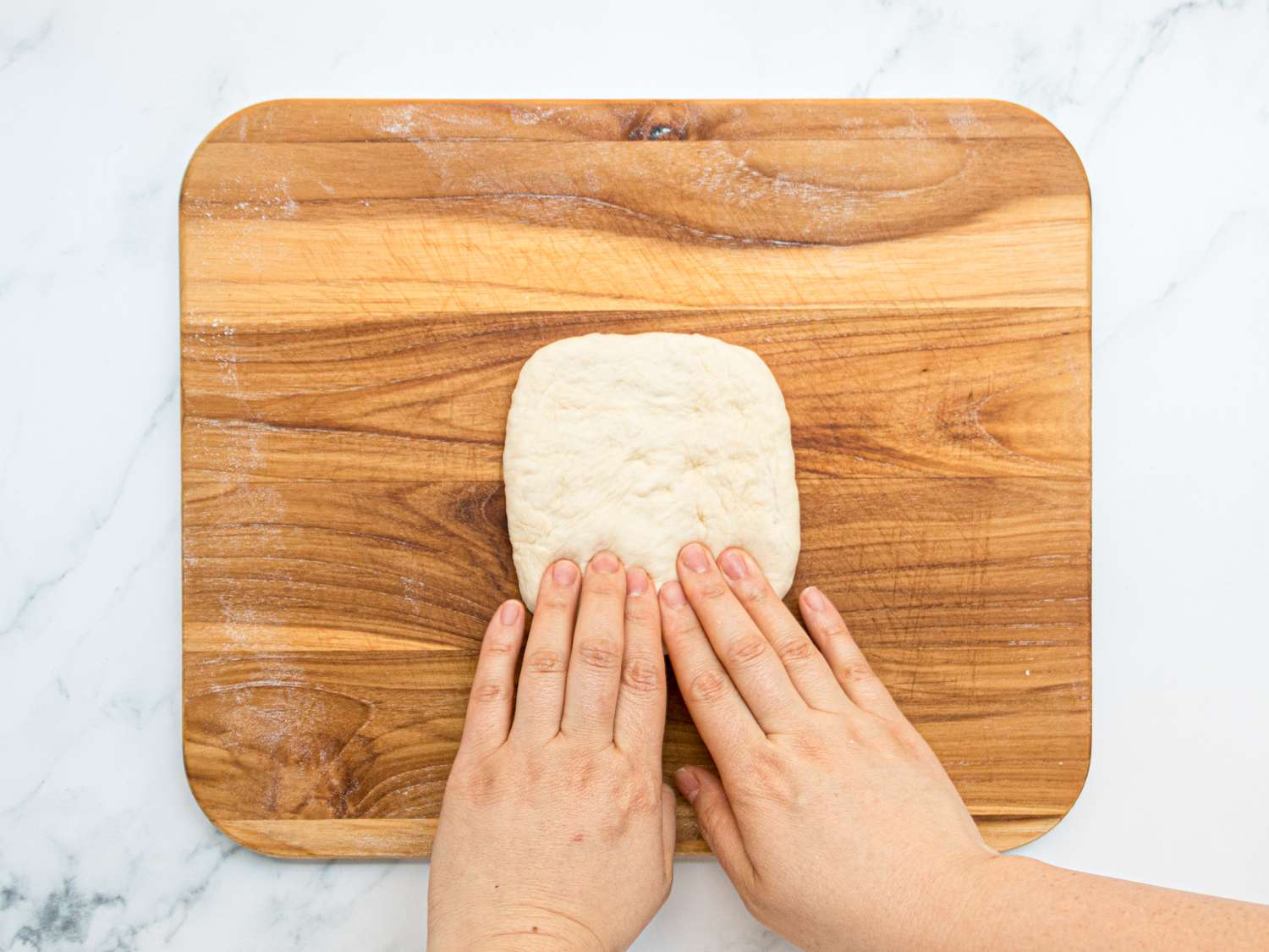 Overhead view of forming a dough square