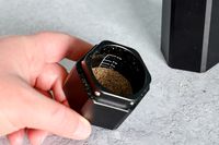 a closeup of the ground pepper in the catch basin of the grinder