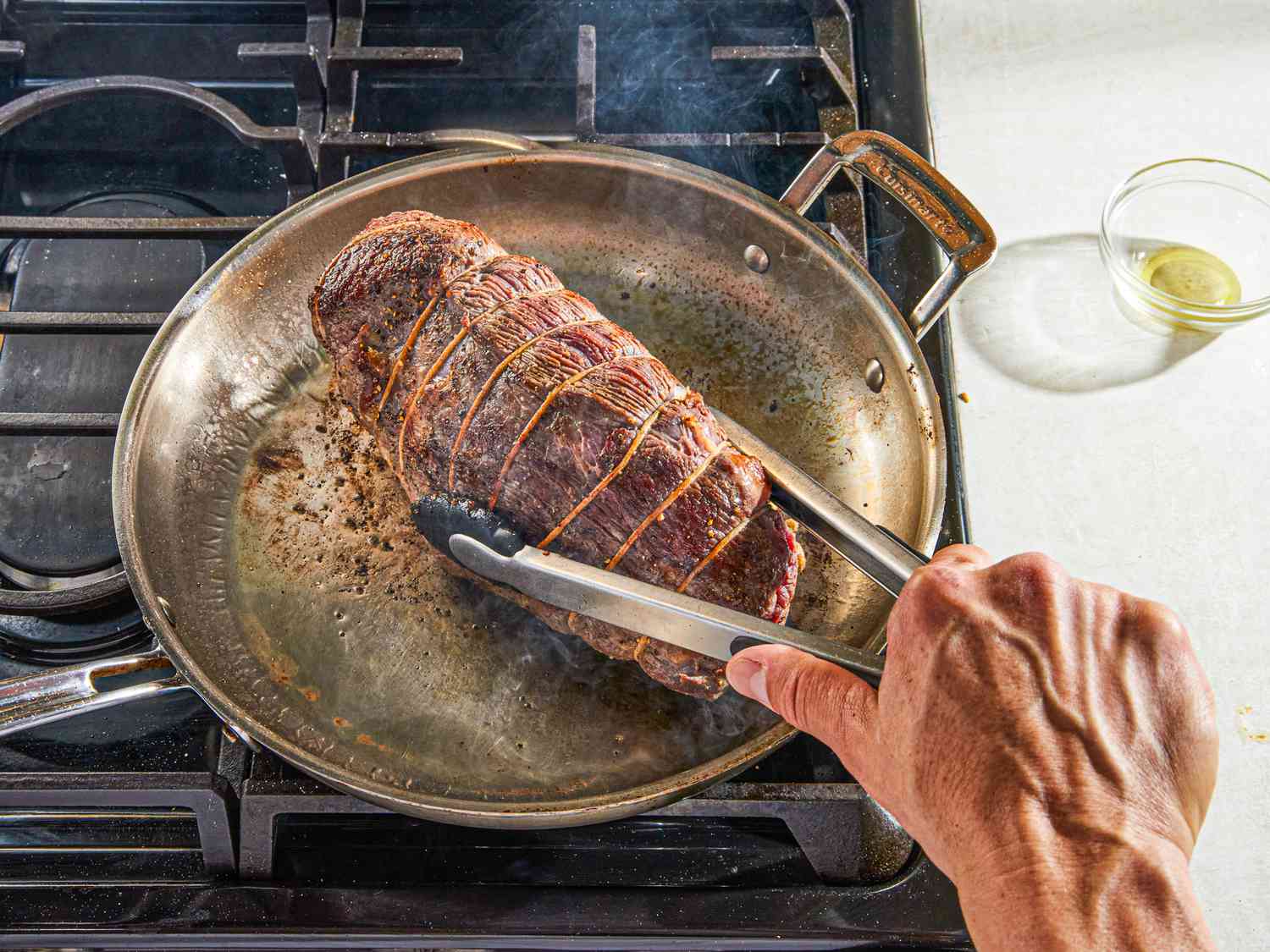 Side view of browning roast beef