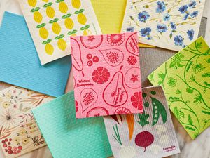 several swedish dish cloths on a marble surface