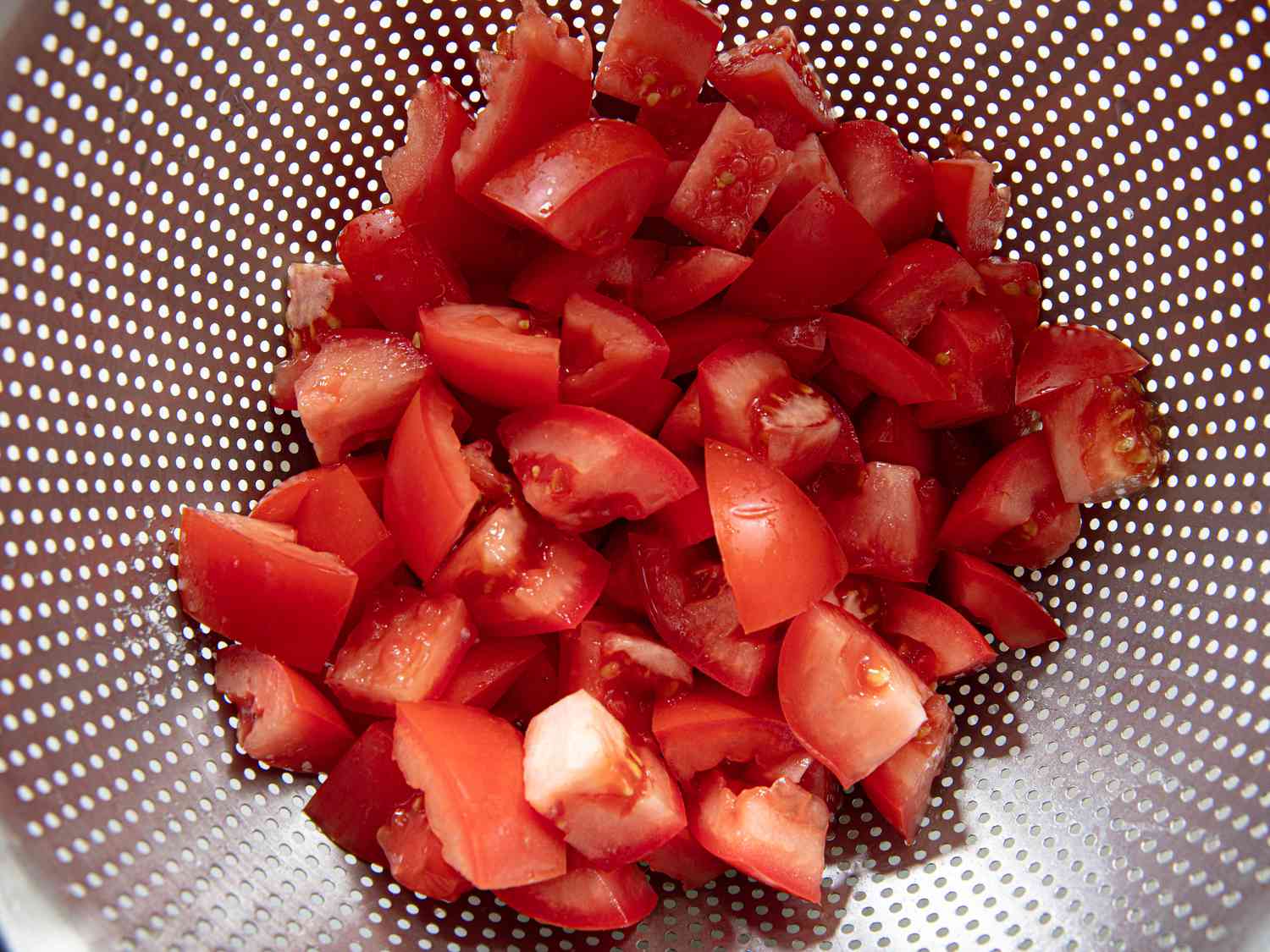 Overhead view of tomatoes draining