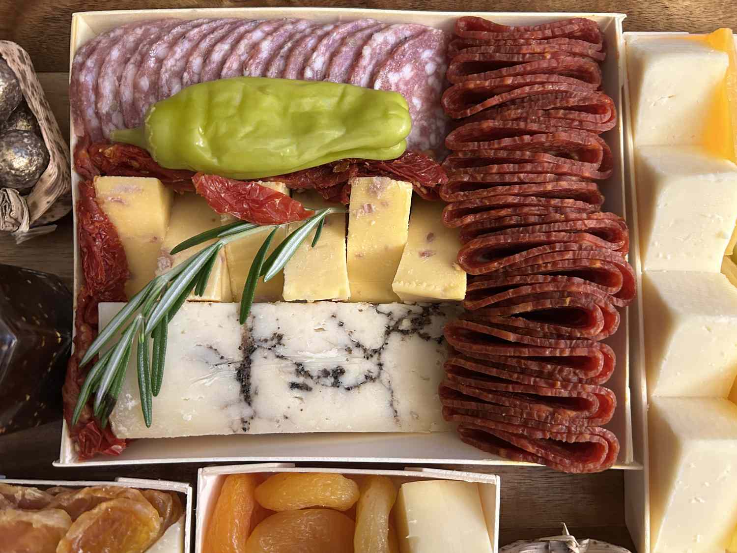 A closeup on cheeses and meats from the Boarderie charcuterie board