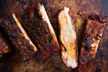 Oven-baked pork ribs split between the bones
