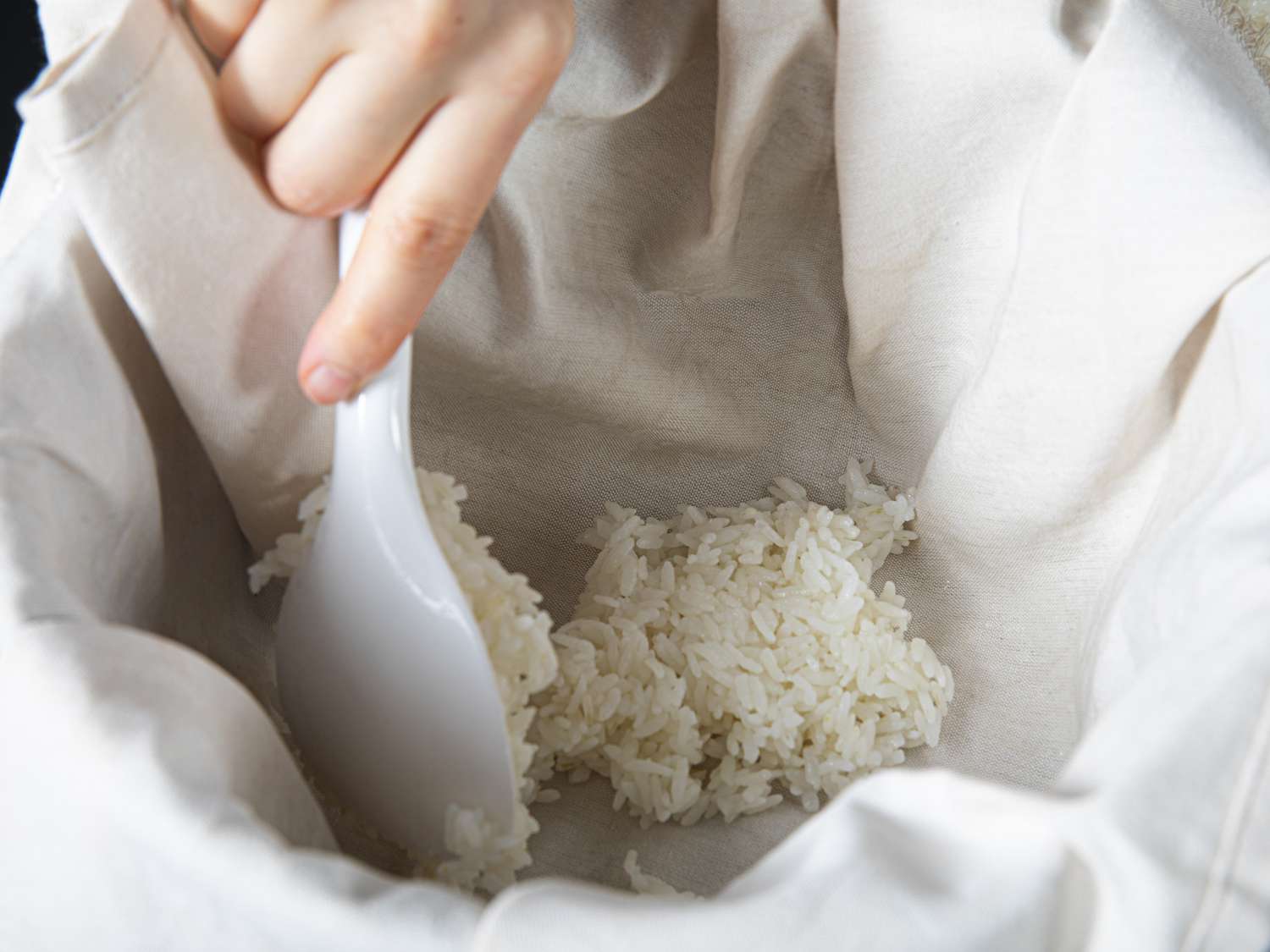 Rice in a towel in a rice cooker
