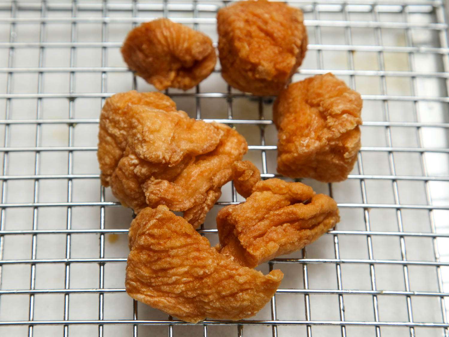 Boneless chicken thighs coated in cornstarch and fried.