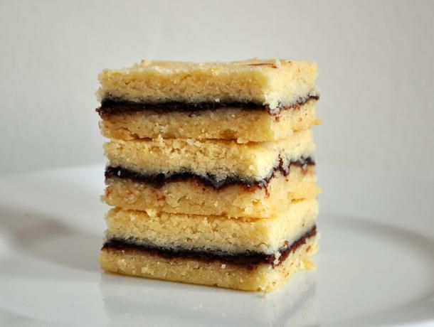 Profile closeup of a stack of shortbread sandwiches.