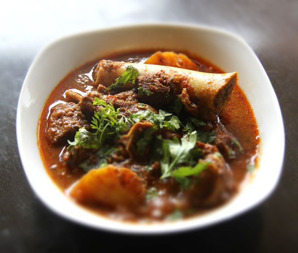 Mangalorean mutton gravy, served in a small bowl.