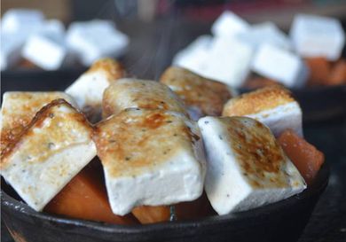 Closeup of brown butter and sage sweet potato casserole.