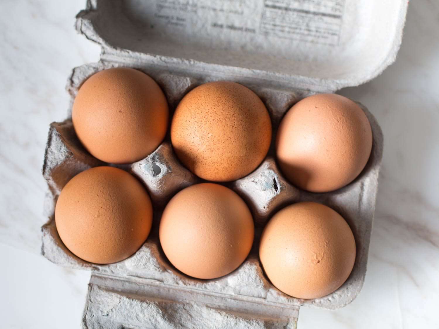 Close-up of a half-carton of eggs.
