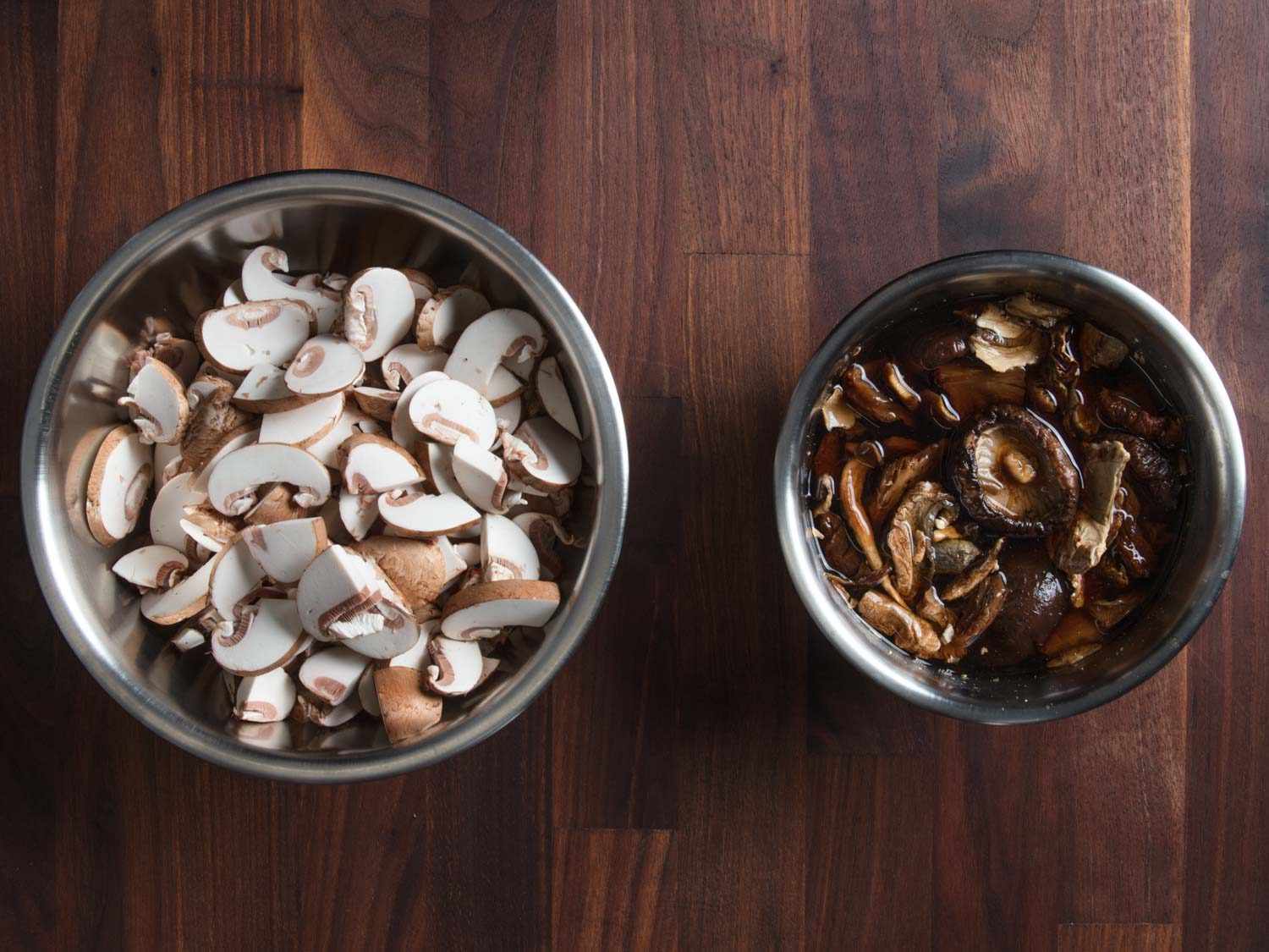 Thinly sliced fresh mushrooms and re-hydrated dry mushrooms, ready to cook.