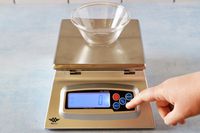 A small glass bowl on the My Weigh kitchen scale.