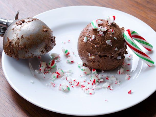 A copp of spiced dark chocolate and candy cane ice cream, dusted with crushed candy canes.