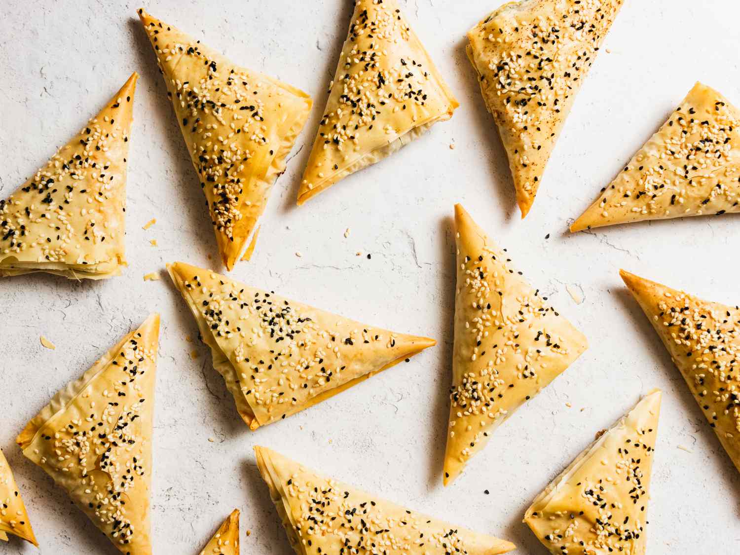 an overhead shot of boreks on a marble surface