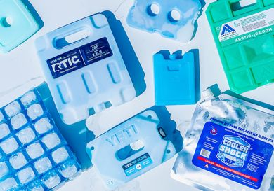 Various types of reusable ice packs arranged on a flat surface