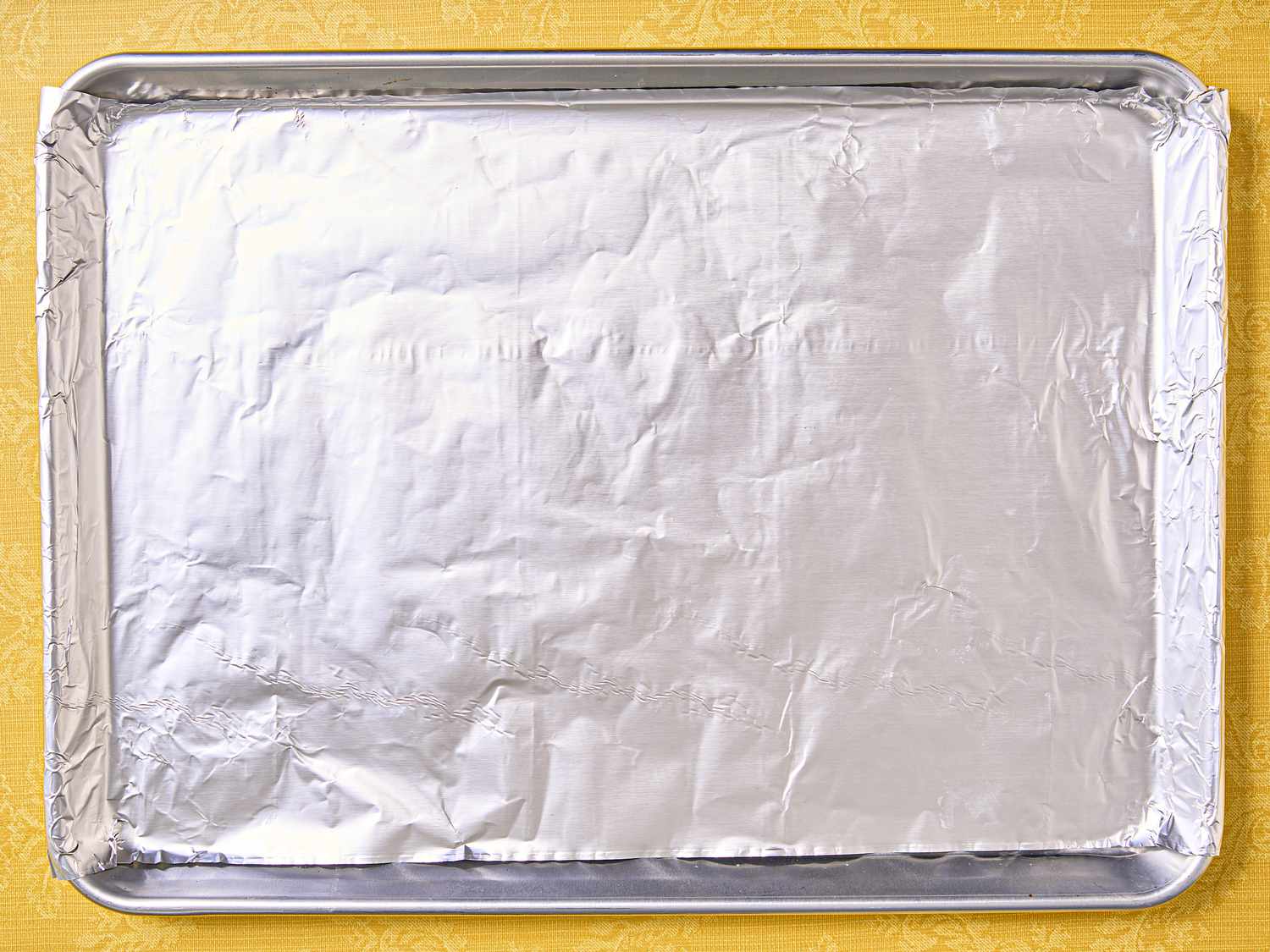 Overhead view of sheet tray with tinfoil