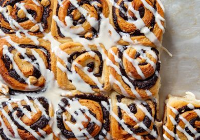 Overhead shot of chocolate hazelnut rolls mascarpone drizzled with glaze