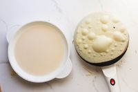 a crepe cooking on the electric crepe maker