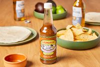 The Pepper Plant Original Hot Sauce (2 Pack) sitting on table