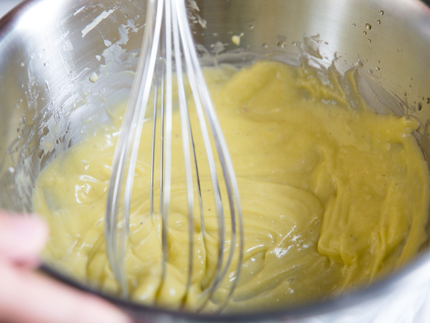 Hand-whisking mayonnaise makes it glossier and less thick.