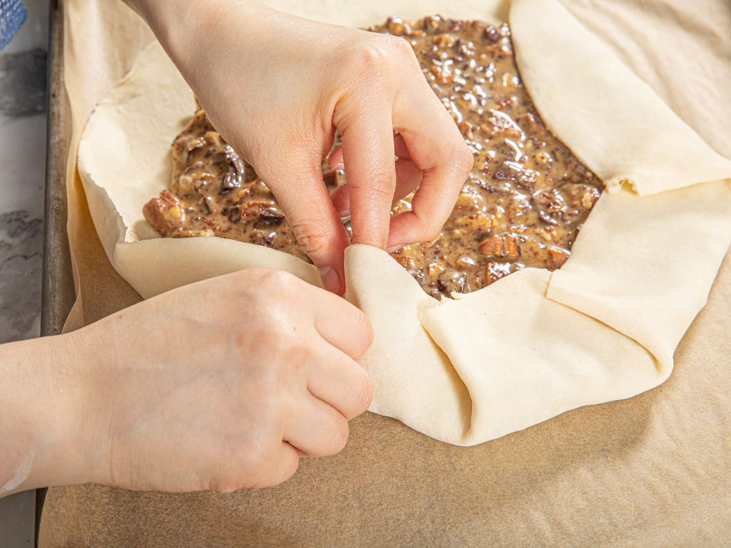 Folding the dough to shape the galette 