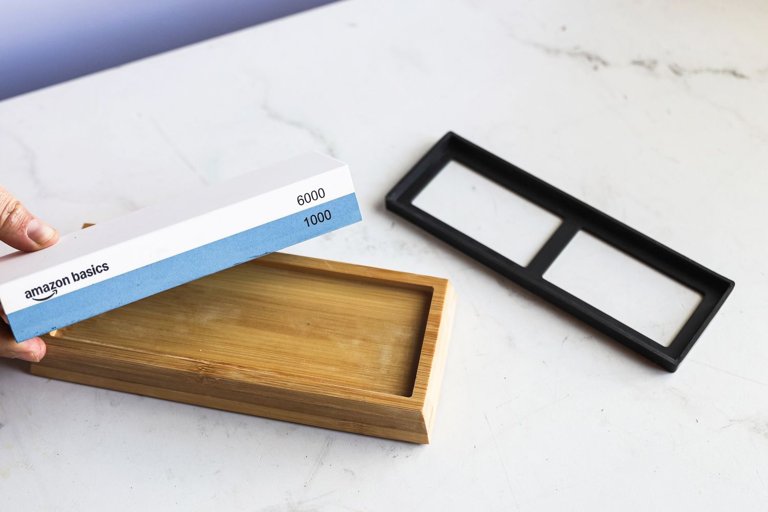 A person assembling the Amazon Basics Whetstone